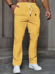 Manfinity Homme Quần dài nam màu trơn có dây rút có túi, quần dài rộng thùng thình, quần đi chơi đơn giản, mùa thu - Màu vàng - Xem 3