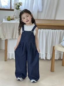 SHEIN Young Girl Deep Blue Denim Suspenders With A Three-Dimensional Bow On The Back,Kid Girls Spring And Summer Casual Vacation Country Boho Wear, Beach Outfits For Kid Girls,Western Street Wear For Girl,Spring Break Outfits,Rave Outfits Festival Denim Overalls,Young Girl Vacay Outfits