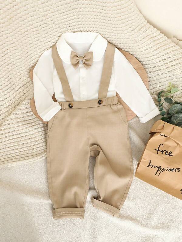 SHEIN 2 piezas Conjunto de ropa de estilo caballero formal lindo para niños pequeños, que incluye camisa de manga larga con cuello y lazo, y pantalones casuales con tirantes. Atuendo elegante y elegante adecuado para fiesta de cumpleaños, fiesta de noche, actuación, boda, luna llena, y celebraciones, primavera/otoño