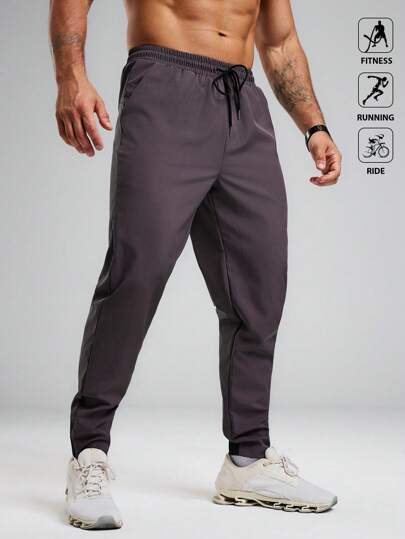 Manfinity Sport Polished 男士休闲纯色抽绳腰斜插口袋运动裤，适合健身、跑步、骑行等运动。