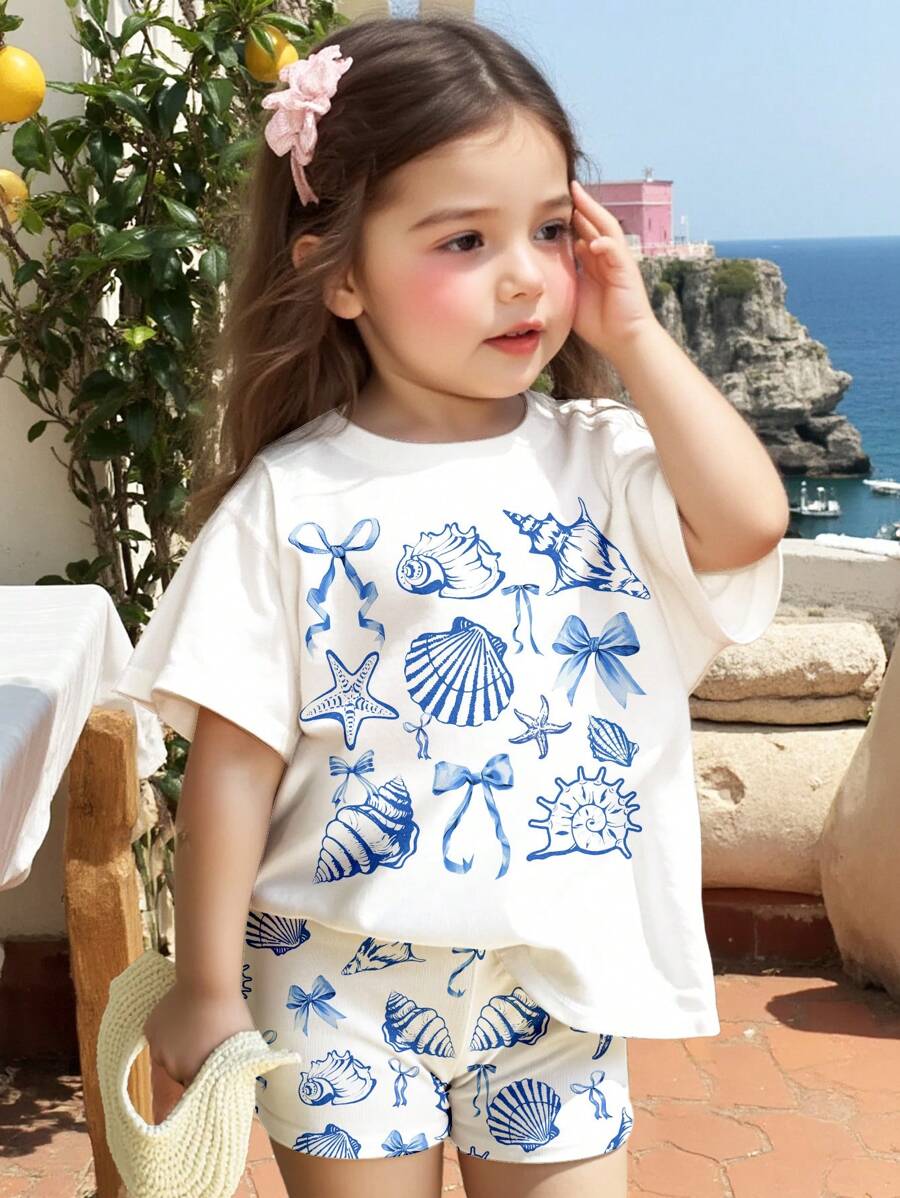 SHEIN 2 件套可爱海洋生物、贝壳、蝴蝶结印花休闲夏季服装 - 适合年轻女孩的短袖上衣和短裤套装,非常适合度假、海滩周末、可爱夏季服装、夏季儿童用品、韩式风格、海滩模式、夏季出游物品 - 彩色 - 查看 1