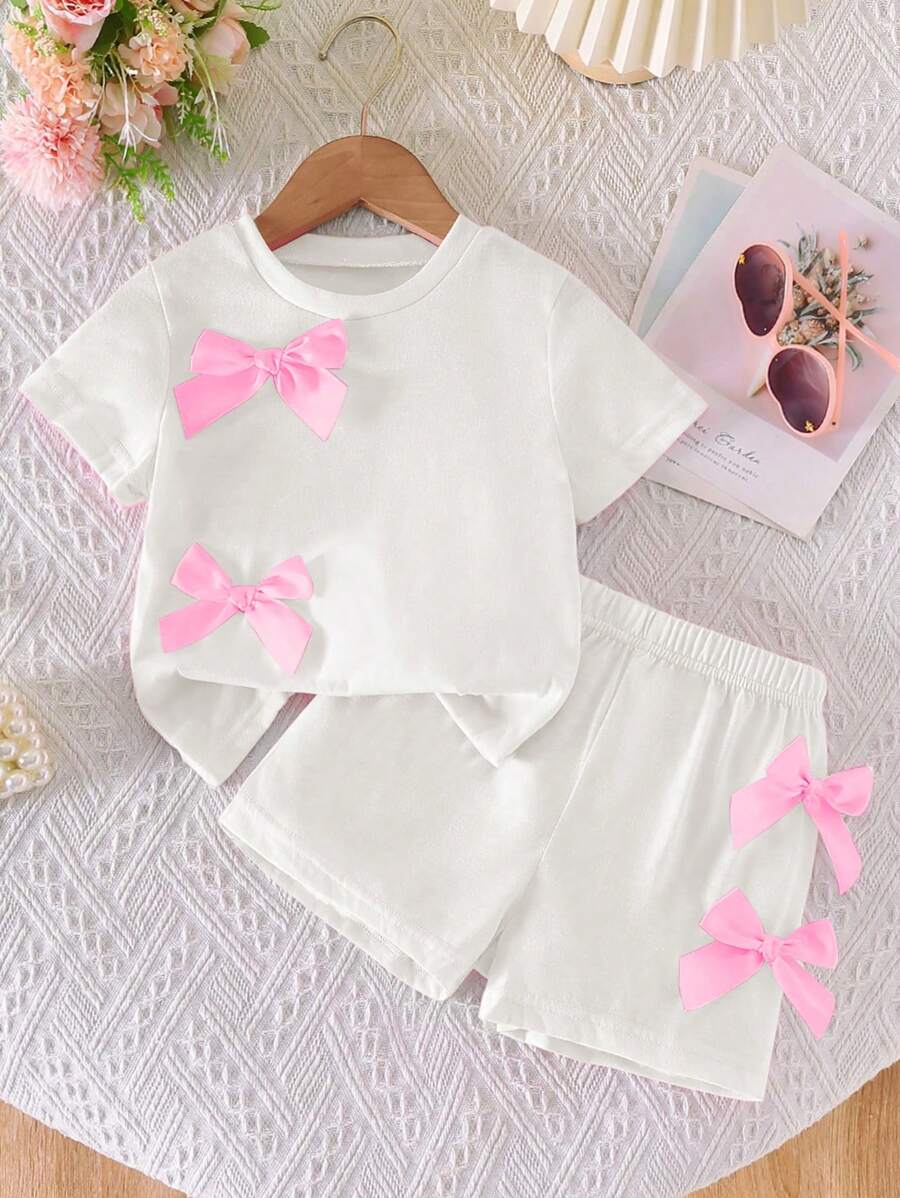 SHEIN 2 件女童休闲可爱蝴蝶结装饰圆领短袖短款上衣和松紧腰短裤套装,亮粉色 - 白色 - 查看 1