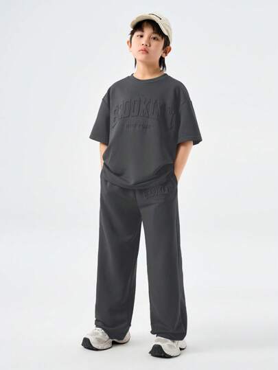 Coolane Kids Conjunto de 2 piezas para adolescentes de primavera/verano: camiseta de manga corta de cuello redondo holgada con caída de hombros y pantalón recto de cintura con cordón