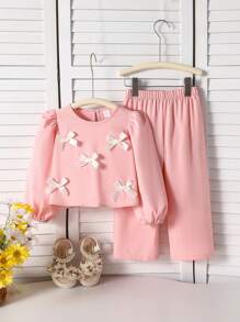 Conjunto de 2 piezas de parte superior de manga larga y pantalones para niña, parte superior rosa con manga abullonada y decoración de moño blanco, traje casual de alta gama cómodo para salidas, reuniones y uso diario