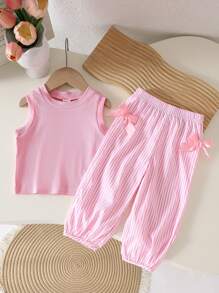 Set di abbigliamento per neonata in stile coreano casual e carino, con maglietta in maglia a scollo a V tinta unita e pantaloni lunghi a righe rosa in tessuto, abbigliamento esterno