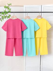 Set de 2 piezas para niñas pequeñas: camiseta de cuello redondo con estampado de dopamina colorido y pantalón de pierna recta con decoración de lazo, conjunto casual para el uso diario y deportes al aire libre, verano