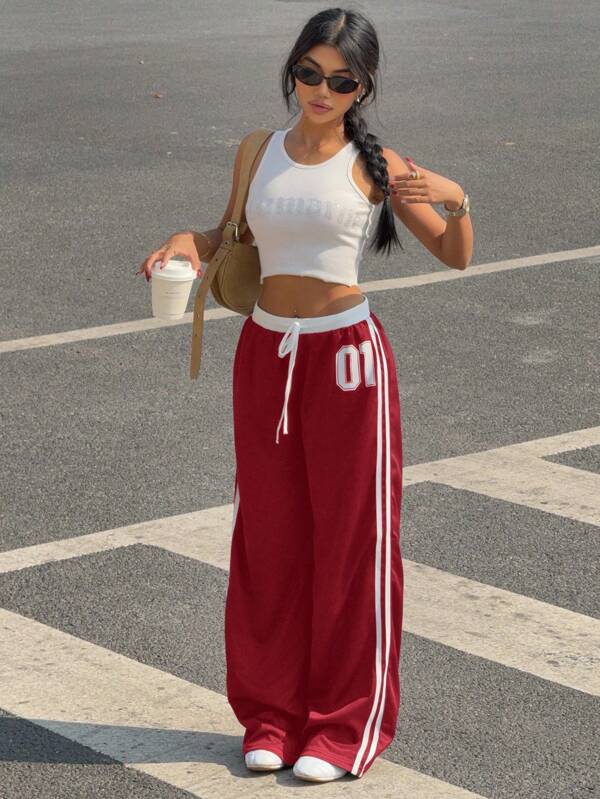 Muchica Pantalones casuales de mujer con bloque de color rojo y estampado de letras, tiro bajo