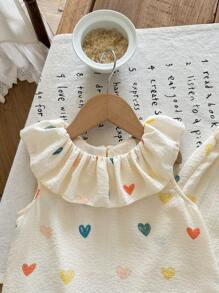 SHEIN LMoss Kids Set de 2 piezas con blusa de volantes con estampado floral pequeño y pantalones de corte relajado para niña joven - Albaricoque - Ver 3