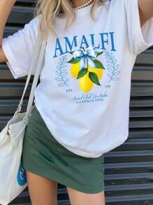 Camiseta básica de manga corta con estampado de letra en forma de limón, decorada con lema casual, rama y lazo para niñas