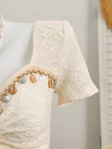 Elenzga 休闲度假短袖 T 恤，正面有流苏、扭结设计和侧开衩