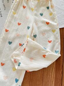 SHEIN LMoss Kids Set de 2 piezas con blusa de volantes con estampado floral pequeño y pantalones de corte relajado para niña joven - Albaricoque - Ver 5