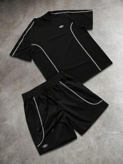 Manfinity EMRG Conjunto de camiseta casual de manga corta de cuello redondo con estampado de letras y shorts con cordón en la cintura para hombre