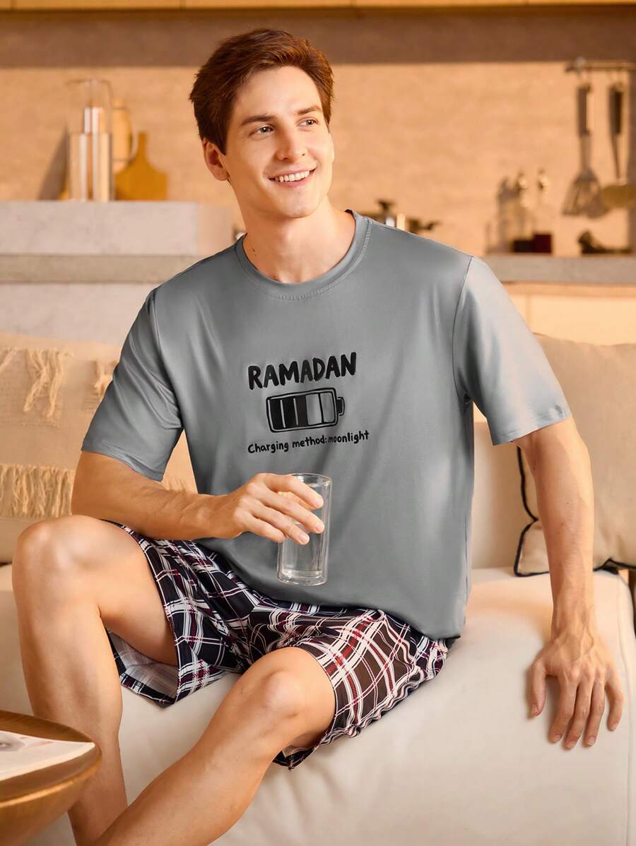 Manfinity Underwear&Sleepwear Basics Men's  Graphic Loungewear Set Comfortable Knitted Fabric Round Neck Short Sleeve T-Shirt With Unique Battery Icon Print And Multicolor Plaid Short Bottoms. Ideal For Relaxed Home Wear.