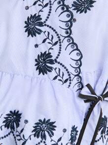 Nöista Sleeveless Wrap Blouse With Floral Embroidery And Scalloped Edges. Peplum Hem, Feminine Silhouette, Elegant, Lace-Style Details, Adjustable Tie Waist, Lightweight, Perfect For Spring, Summer, Or Casual-Chic Looks. - Blue and White - View 9