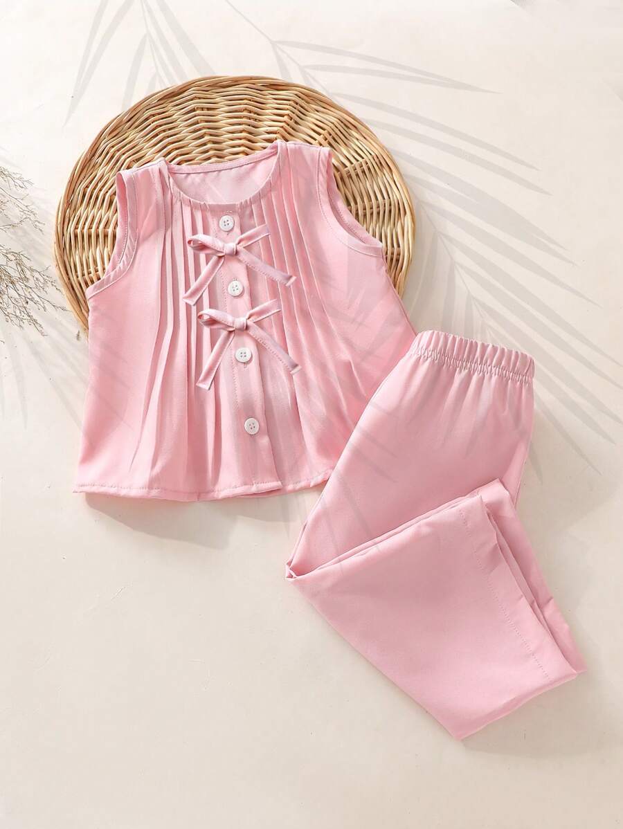 SHEIN Set de 2 piezas de ropa casual para niñas bebé - Top sin mangas con decoración de volantes y lazo, y pantalones largos de cintura elástica, cómodo para primavera/verano/otoño, adecuado para usar en casa y al aire libre - Rosa - Ver 1