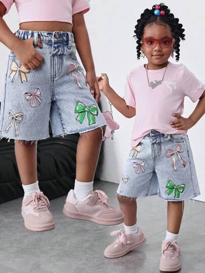 SHEIN Quần short denim dáng rộng nhiều màu sắc cho bé gái, có nơ trang trí, trang phục thường ngày phong cách đồng quê boho cho bé gái mùa xuân và hè, trang phục đi biển, trang phục đường phố miền Tây cho bé gái, kỳ nghỉ xuân, quần jean lửng cho lễ hội âm nhạc, kỳ nghỉ.