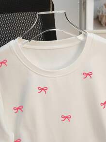SHEIN Camiseta casual de mujer de cuello redondo y manga corta con estampado de moño