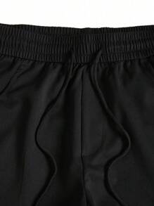 Manfinity Homme Calça Casual Folgada de Rua com Bolsos Cargo e Cordão na Cintura, Cor Sólida - Preto - Visão 4