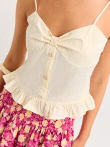 Nöista Débardeur féminin sans manches avec bretelles réglables. Présente une fermeture boutonnée à l'avant, un détail de buste froncé et un ourlet volant - parfait pour les looks d'été ou le chic décontracté.