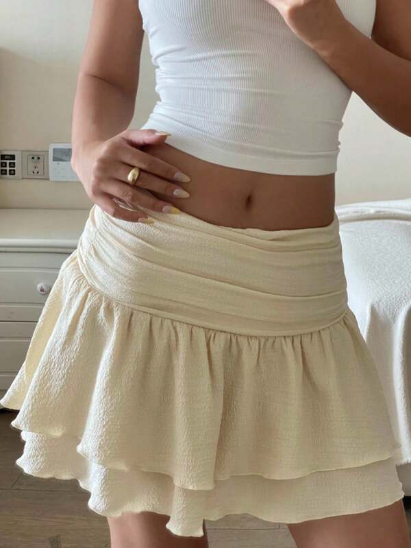 Falda mini acampanada de gasa con pliegues en la cintura para adolescentes, estilo elegante de vacaciones. Falda mini acampanada de punto blanco con textura calada, versátil para el verano