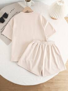 Conjunto de dos piezas para niña preadolescente con camiseta de manga corta de cuello redondo holgada con gráfico de letra y pantalones cortos de estilo informal de punto - Albaricoque - Ver 2