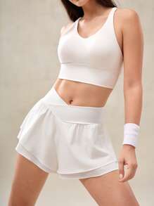 OutZeal Pantaloncini da donna traspiranti e ad asciugatura rapida, con pantaloncini interni incorporati, in vita incrociata, bianchi, per sport, allenamento, tennis