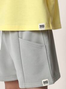 Sumwon Studios 青年宽松运动套装，休闲夏季运动休闲装，带有徽标印花、运动短裤和宽松 T 恤搭配