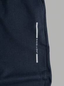 RueChic Pantalones de chándal regulares para hombres con cintura de cordón elástico y estampado de letras