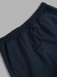 RueChic Pantalones de chándal regulares para hombres con cintura de cordón elástico y estampado de letras