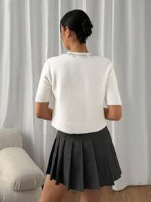 EURMUSE Women's Embellished Button-Up Wool Cardigan – Short-Sleeve Design With Delicate Beaded Neckline Detailing, Ribbed Hem Edges, And Soft Knit Fabric For A Cozy Yet Chic Winter Layer White Cropped Cardigan White Knit Cardigan Rhinestone Cardigan Pearl Button Cardigan,Long Cardigans Woman,Petite Cardigans,Cardigans - Cream - View 2