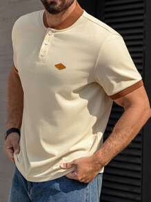 Manfinity Homme Camisa casual de manga corta con botones y parches de unicolor para hombres de talla grande