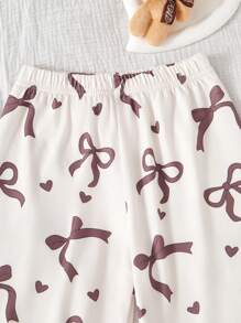 2 件套女童可爱蝴蝶结印花休闲圆领短袖上衣和荷叶边下摆 3/4 裤家居服套装