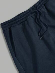 RueChic Pantalones de chándal regulares para hombres con cintura de cordón elástico y estampado de letras