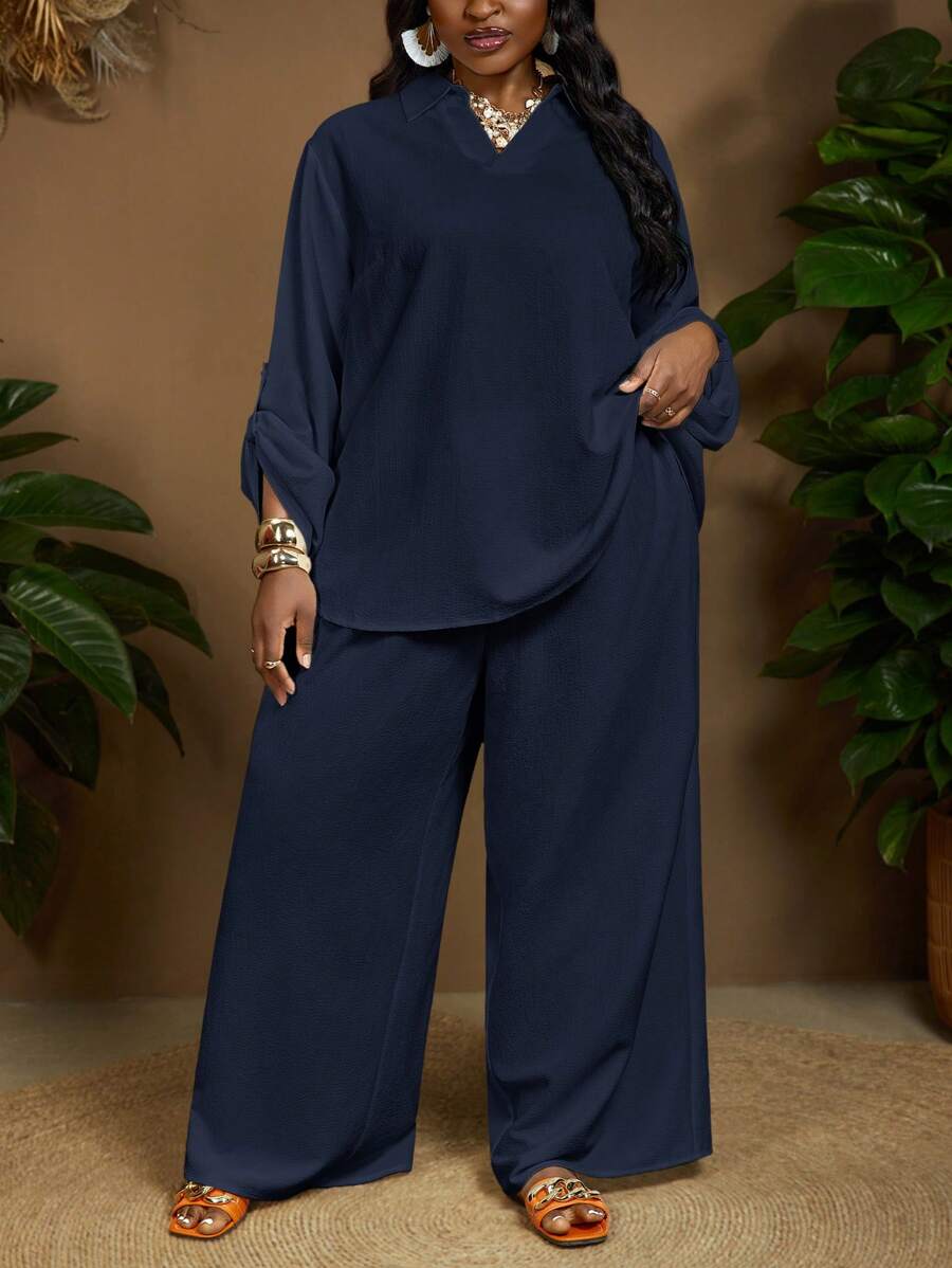 SHEIN CURVE+ Bộ đồ thường ngày 2 món cho nữ, áo sơ mi tay bo gấu màu trơn cỡ lớn và quần ống rộng, kiểu dáng cong, trang phục đi biển phong cách Boho dành cho nữ/trang phục đi biển/kỳ nghỉ trên bãi biển/đồ dùng cần thiết cho bãi biển/tốt nghiệp/tiệc trà cỡ lớn Bộ quần dài cỡ lớn Bộ hai món Bộ 2 món Quần dài cong cỡ lớn Bộ áo cánh và quần - Màu xanh hải quân - Xem 1