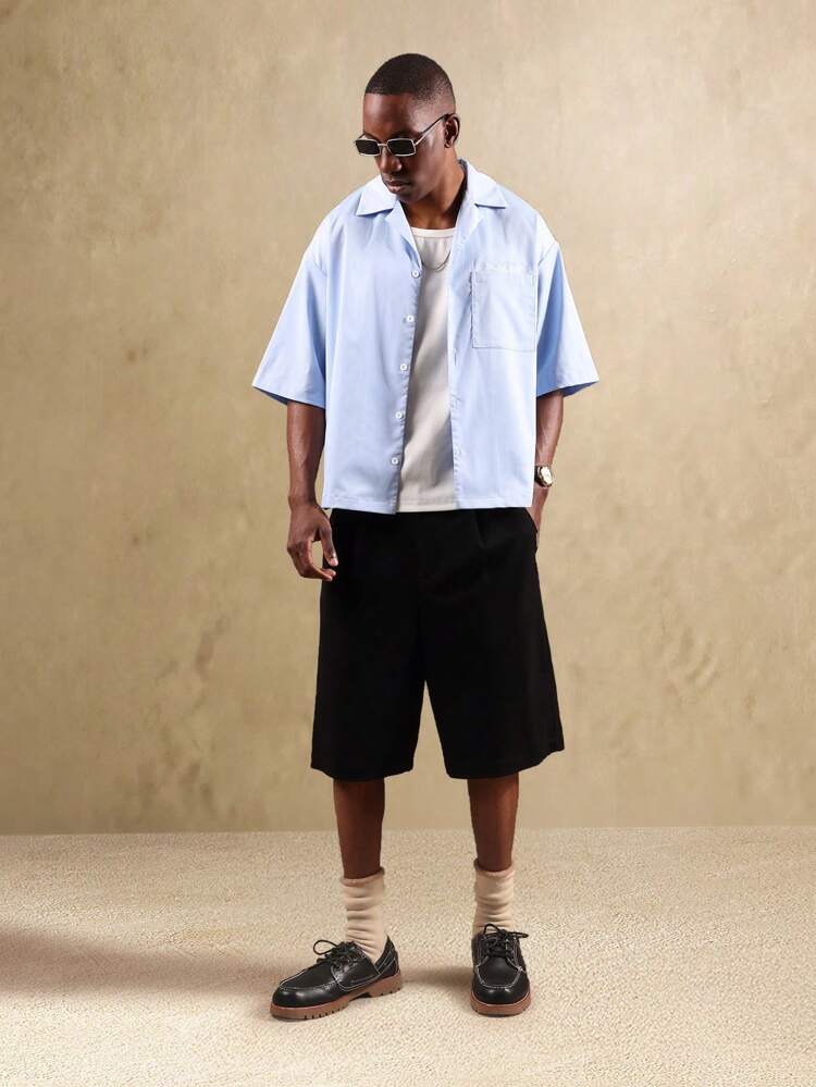 Chemise boutonnée à manches courtes et col à revers, coupe carrée