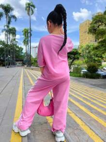 Conjunto informal de niña preadolescente para uso diario escolar, conjunto de Top suelta de cuello redondo con ribete de cinta a contraste y pantalón de chándal a juego, color rosa claro