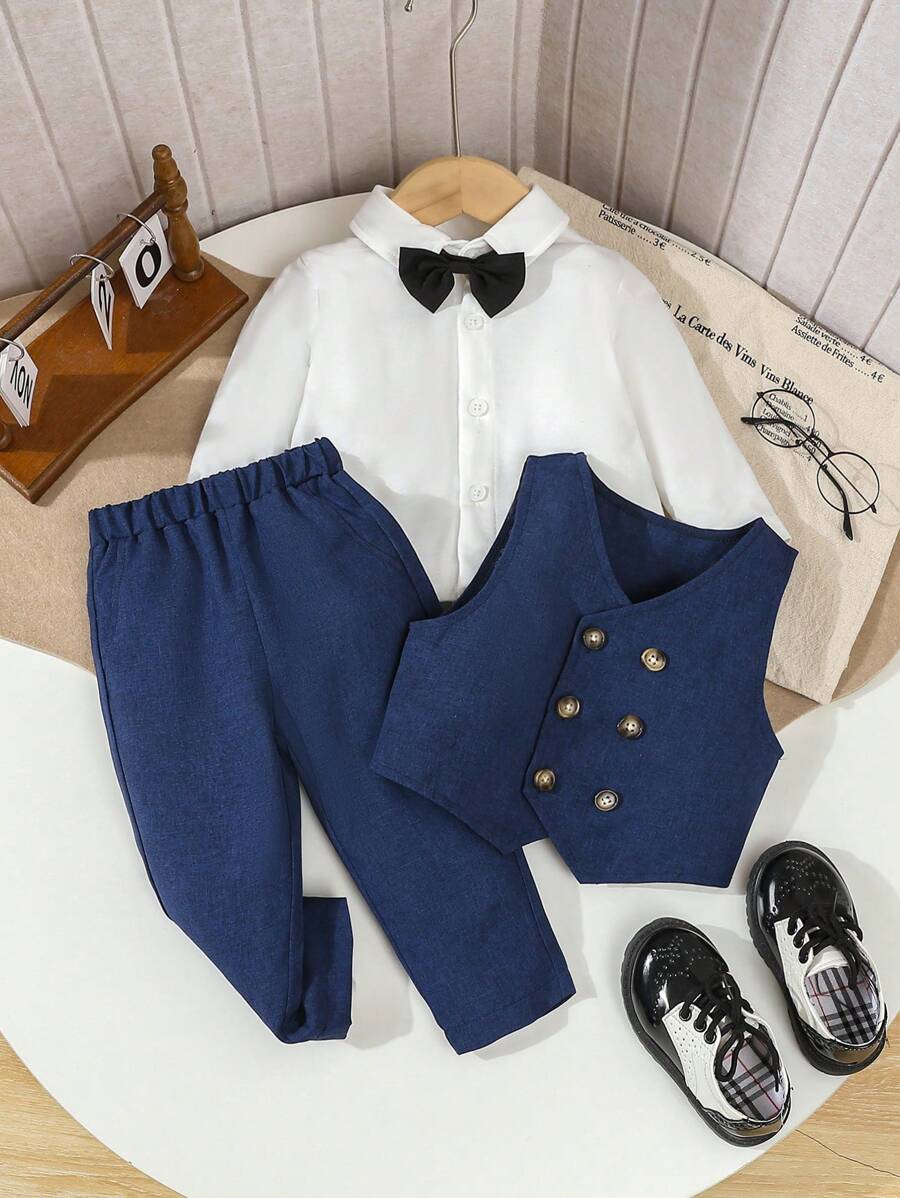 SHEIN Bộ đồ vest 3 món cho bé trai, áo vest hai hàng khuy + quần thường ngày + nơ đen, không bao gồm áo sơ mi, thời trang, thanh lịch, đẹp trai, vải thoải mái, phù hợp cho mùa xuân/thu, tốt nhất để mặc hàng ngày, tiệc tùng, đám cưới, lễ rửa tội, biểu diễn, sự kiện - Màu xanh hải quân - Xem 1