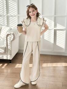 Set de 2 piezas para niñas con top de punto de color albaricoque con volantes y decoración de perlas, y pantalones 3/4 con bajo asimétrico. Elegante vestimenta diaria y de resort para el verano