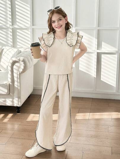 2 件女童杏色针织荷叶边珍珠装饰上衣和不对称下摆 3/4 裤套装，优雅的夏季日常和度假装