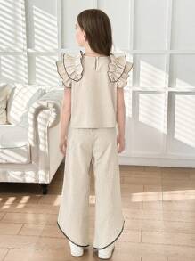 Set de 2 piezas para niñas con top de punto de color albaricoque con volantes y decoración de perlas, y pantalones 3/4 con bajo asimétrico. Elegante vestimenta diaria y de resort para el verano