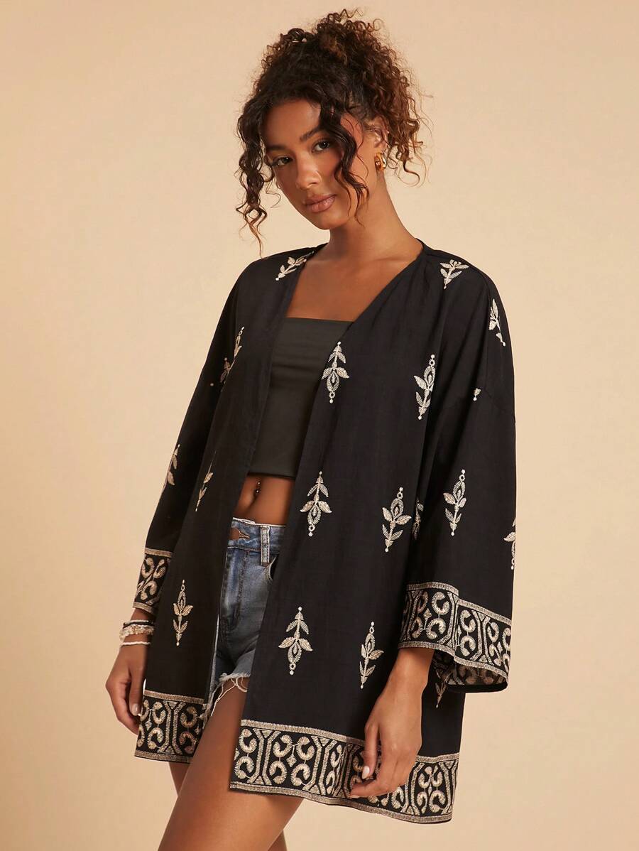 Travachic Elegante blusa larga bohemia negra con detalles estampados y diseño de nudo, kimono cárdigan bohemio, adecuado para vacaciones, té de la tarde, temporada de bodas, crucero por la playa, viaje por la ciudad, vacaciones bohemias, festival de música, ropa de playa, Pascua, playa para mujer, elegante para mujer, vacaciones para mujer, concierto para mujer, vacaciones tropicales para mujer, vacaciones, bohemio, para primavera, verano y otoño - Negro - Ver 1