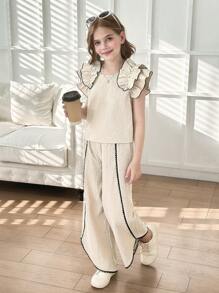 Set de 2 piezas para niñas con top de punto de color albaricoque con volantes y decoración de perlas, y pantalones 3/4 con bajo asimétrico. Elegante vestimenta diaria y de resort para el verano
