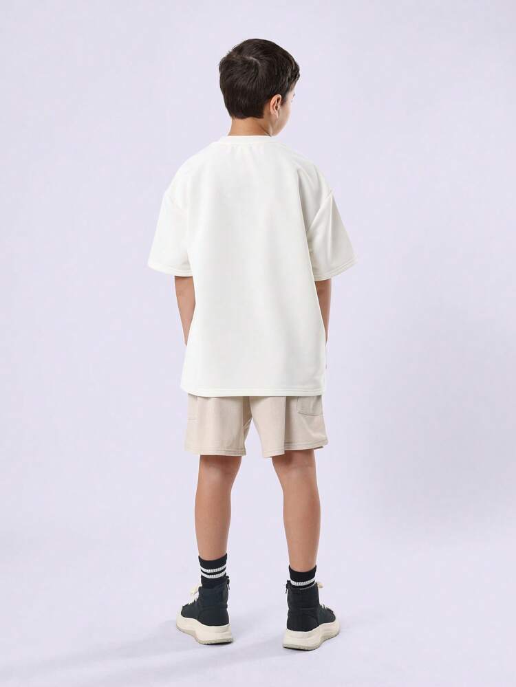 Completo T-shirt e pantaloncini oversize con dettaglio laterale a righe