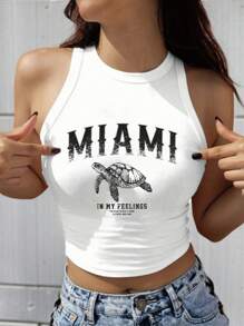 SHEIN EZwear 白色无袖上衣，饰有休闲迈阿密海龟图案，适合夏季、度假、海滩穿着，34% 棉。迈阿密图案背心，白色图案露脐上衣，夏季上衣，女士度假迈阿密背心，女士夏季背心，白色露脐上衣，夏季度假上衣，海龟图案T恤，女士夏季上衣，返校季上衣 - 白色 - 查看 7