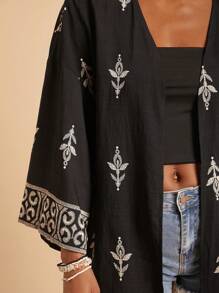 Travachic Elegante blusa larga bohemia negra con detalles estampados y diseño de nudo, kimono cárdigan bohemio, adecuado para vacaciones, té de la tarde, temporada de bodas, crucero por la playa, viaje por la ciudad, vacaciones bohemias, festival de música, ropa de playa, Pascua, playa para mujer, elegante para mujer, vacaciones para mujer, concierto para mujer, vacaciones tropicales para mujer, vacaciones, bohemio, para primavera, verano y otoño - Negro - Ver 6