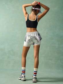 VARSITIE Women's Shiny Silver Athletic Skort Featuring Contrasting White Inner Shorts. These Short Activewear Bottoms Come With A Pocket And Knit Fabric For High Elasticity And Comfortable Movement.