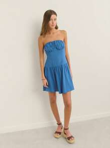 Nöista Fitted Strapless Silhouette Textured Knit Fabric With Ruched Bust And Flared Skirt; Lightweight Breathable Design; Perfect Beach Outfits For Women And Casual Pride Celebration Looks; Versatile Airport Outfit; Summer Essential.