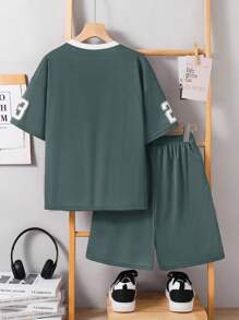 SHEIN Conjunto de 2 piezas de camiseta de manga corta oversize y shorts deportivos para niños preadolescentes