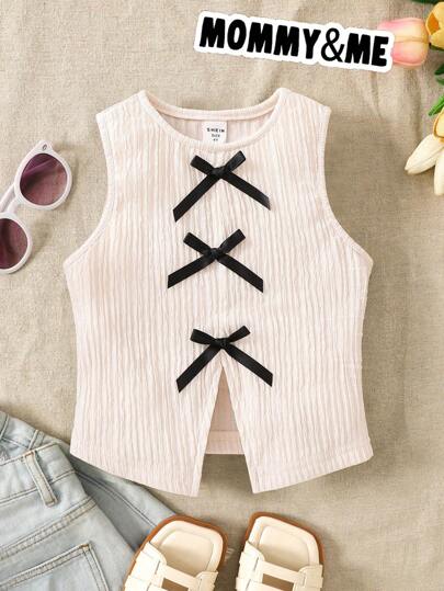 女童圆领休闲撞色蝴蝶结开衩露背无袖针织上衣，可爱甜美复古时尚。适合母女、姐妹穿着。春夏皆宜。