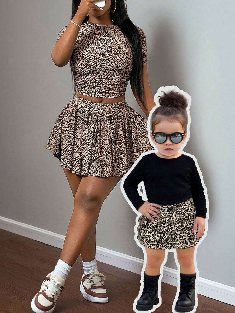 SHEIN Conjunto informal de bebé niña con top de punto de manga larga negro y shorts con cintura elástica de estampado de leopardo con volantes